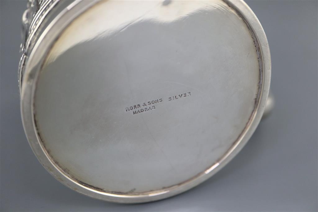 A late 19th century Indian repousse silver mug by P. Orr & Sons, Madras,